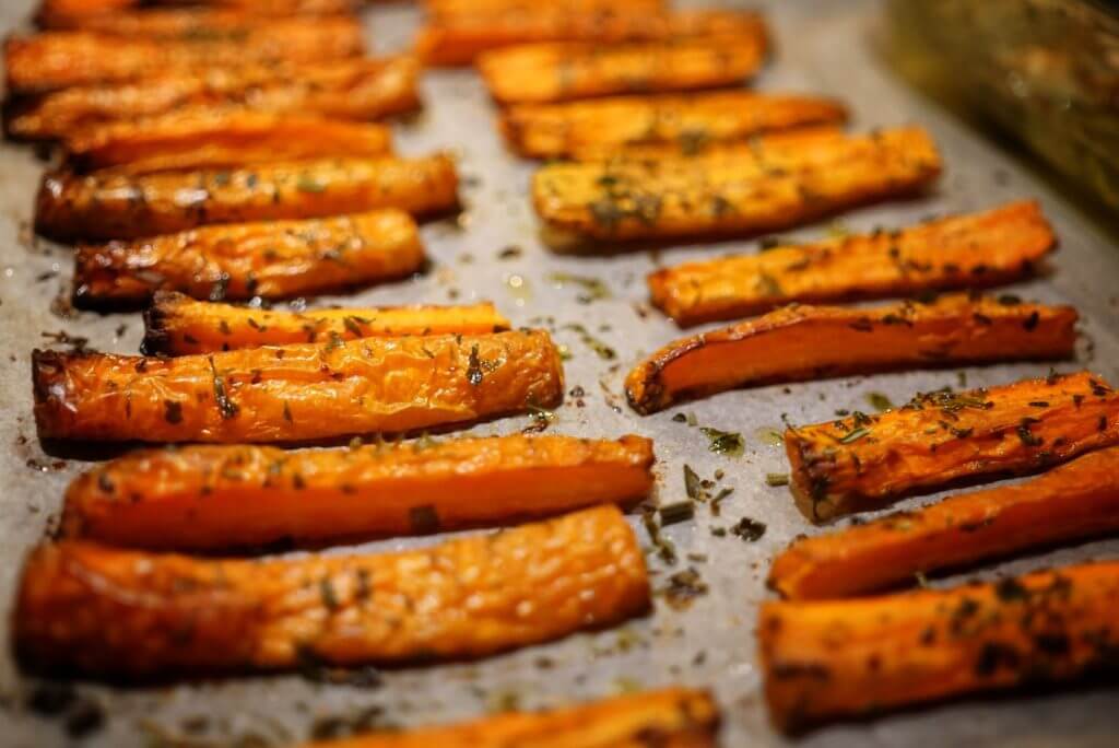 oven baked carrots on baking sheet.