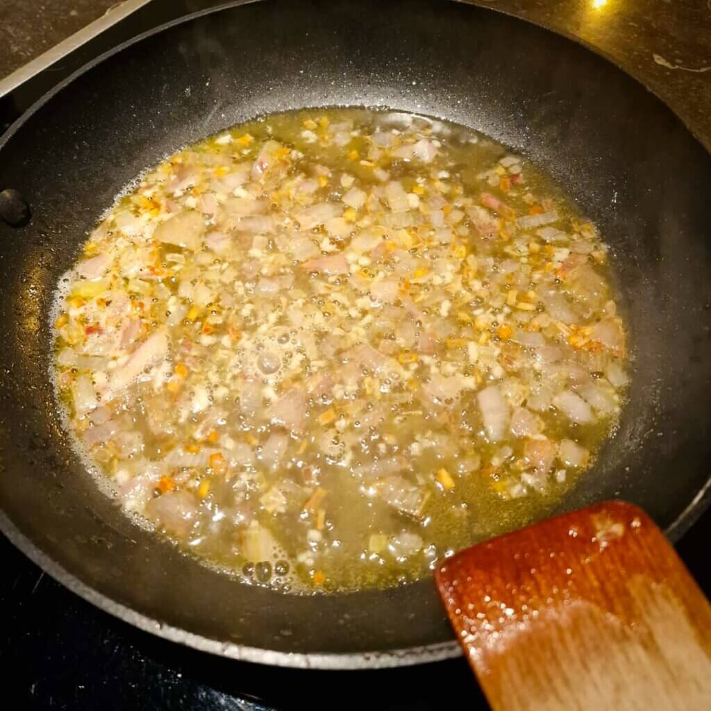 Sautéed onion and garlic with dry white wine.