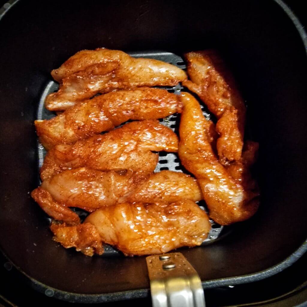 Air fryer chicken strips in air fryer basket